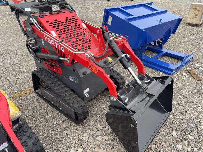 Unused AGT Stand On Skidsteer, Model YSRT14, Gas Engine, 31” Material Bucket, 420 CC (15hp) Engine. Headlights, Hydraulic Hookups on Boom, 6” wide Rubber Tracks,