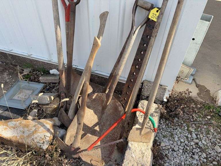 (2) Steel Grain Shovels, Barn Scraper, Maddox, Hoe, Axe, Short Handle Round Point Shovel, Long Handle 4 Tine Pitch Fork, Short Handle 4 Tine Pitch Fork, 3 pt Drawbar, Bow Saw