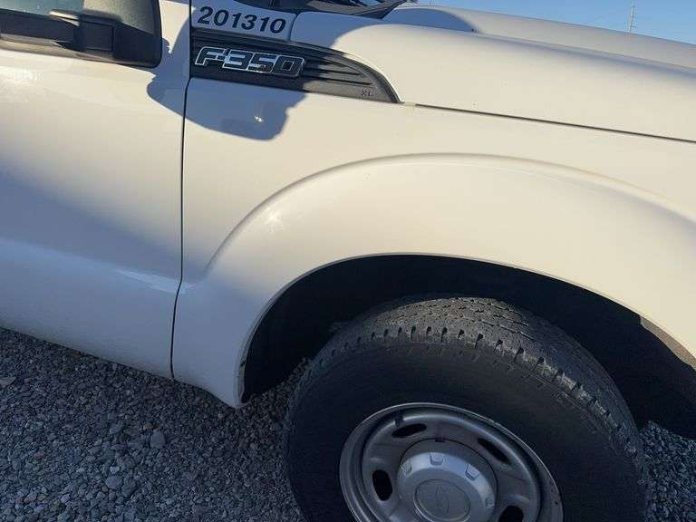 (TITLE) 2013 F-250 Super Duty XL Ford Pick Up, 2 WD, Matching Firestone 245/75R17 Tires (40%) AC Blows Cold,All Electronic Controls Work, Windows , Mirrors, Cruise Control, Etc. Vinyl Seats And Floor Mat,  No Tears, 8’ Bed,  Utility Rack, Working Tommy Gate, Reese Hitch W/ Trailer Electric Receptacle,  6.2 Liter V 8 Gas Engine,Fleet Maintained, Rust Free  W/ Minor Dings For A 12 Year Old Truck.