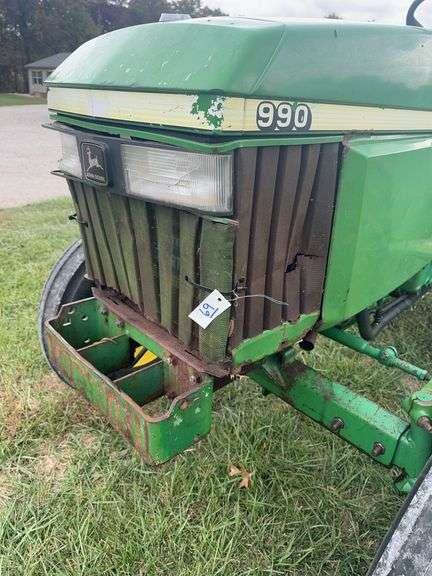 John Deere 990 Compact Tractor, Yanmar 40 HP 4 Cylinder Engine, ROPS,  14.9-24 Rear Tires 50% (Cracked), 6.00-16 Fronts 80%, Rear PTO, Category 1   3 Point Hitch, ROPS, Tachometer Works, Hour Meter Not Working, Fuel And Temp Gauges Working, 9 Forward Speeds, 3 Reverse Speeds, Strong Clutch , Brakes Work, Starts And Runs With No Know Issues, Power Steering 2 Wheel Drive