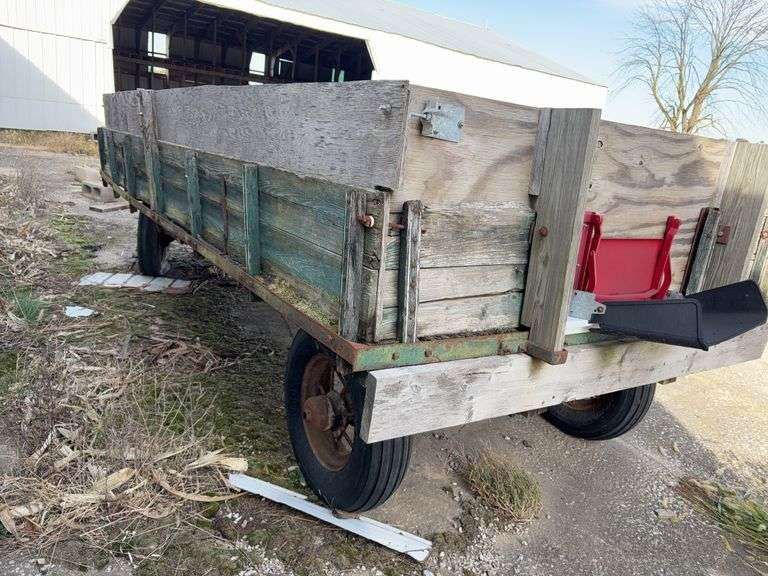 Hay Frame Wagon with SideBoards, 14’ Length x 6’-8” Wide, Spoke Rims, 3 Tires Hold Air, 1 Tire is Flat, Wagon bed has Sheet Metal on Floor, Hydraulic Dump w/ Cylinder,