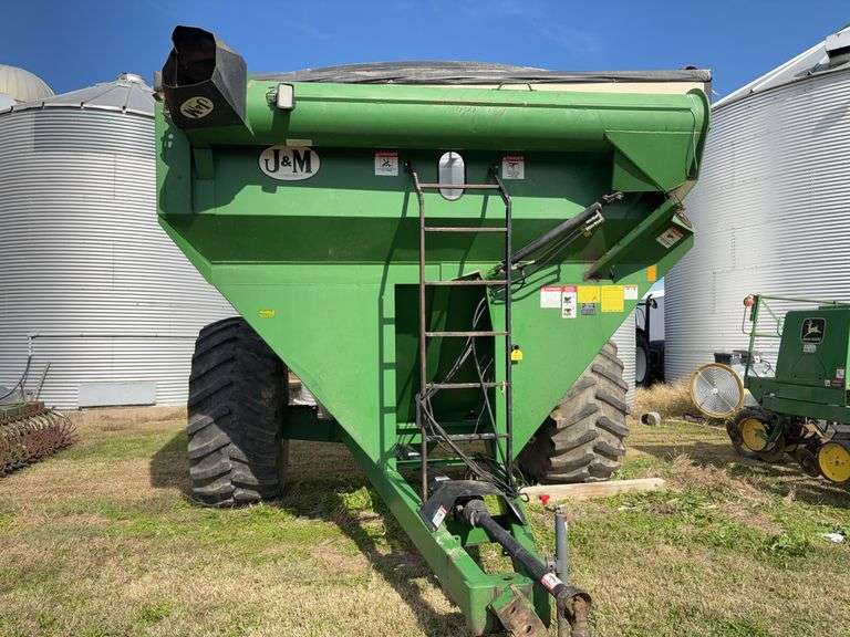 J & M 750 Grain Cart, 14” Discharge Auger, 1000 PTO, Rolling Tarp, No Scales, Tire Size 30.5L-32, Tires Hold Air