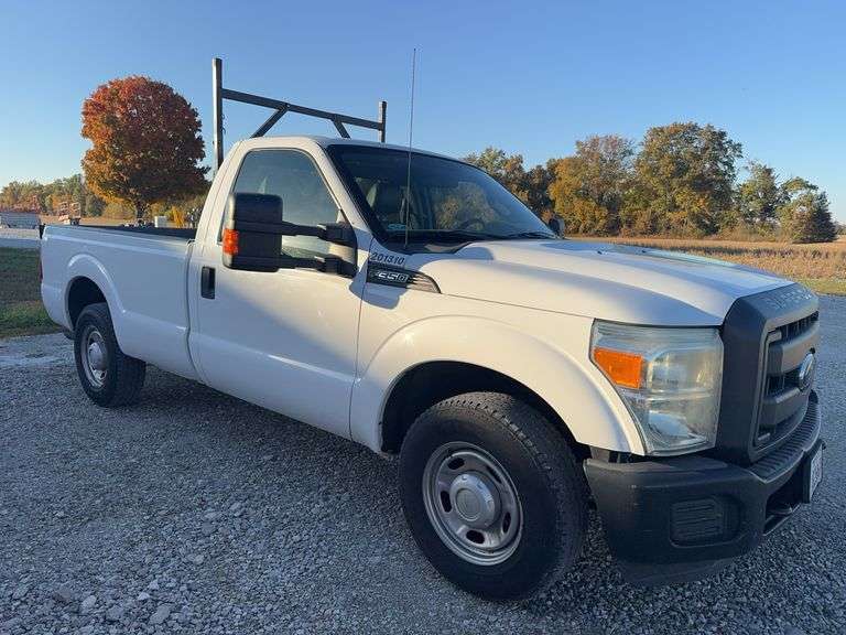 (TITLE) 2013 F-250 Super Duty XL Ford Pick Up, 2 WD, Matching Firestone 245/75R17 Tires (40%) AC Blows Cold,All Electronic Controls Work, Windows , Mirrors, Cruise Control, Etc. Vinyl Seats And Floor Mat,  No Tears, 8’ Bed,  Utility Rack, Working Tommy Gate, Reese Hitch W/ Trailer Electric Receptacle,  6.2 Liter V 8 Gas Engine,Fleet Maintained, Rust Free  W/ Minor Dings For A 12 Year Old Truck.