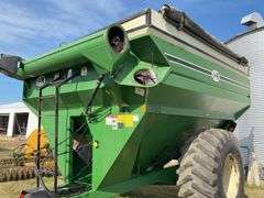 J & M 750 Grain Cart, 14” Discharge Auger, 1000 PTO, Rolling Tarp, No Scales, Tire Size 30.5L-32, Tires Hold Air