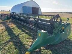 John Deere 925 Grain Head, Fits John Deere 9500 Combine, Fore/Aft Reel Cylinders, Has New Arm on Sickle Drive , Sickle Sections Good , Reel Has Composite Fingers, Stainless Pan, Poly Skids, Well Maintained Head, Header Cart IS NOT Included with Header.  See Lot #307A.