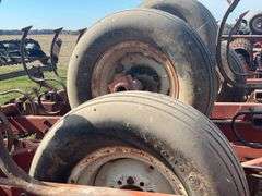 Kewanee Field Cultivator, 18’ Wide, Hydraulic Folding, Rolling Baskets in Back, Shovels Are Worn and Some Missing, 11L-15 SL Tires Fair Some Have Cracks, Hydraulic Lines Need Attention
