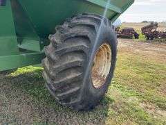 J & M 750 Grain Cart, 14” Discharge Auger, 1000 PTO, Rolling Tarp, No Scales, Tire Size 30.5L-32, Tires Hold Air