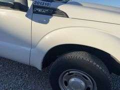 (TITLE) 2013 F-250 Super Duty XL Ford Pick Up, 2 WD, Matching Firestone 245/75R17 Tires (40%) AC Blows Cold,All Electronic Controls Work, Windows , Mirrors, Cruise Control, Etc. Vinyl Seats And Floor Mat,  No Tears, 8’ Bed,  Utility Rack, Working Tommy Gate, Reese Hitch W/ Trailer Electric Receptacle,  6.2 Liter V 8 Gas Engine,Fleet Maintained, Rust Free  W/ Minor Dings For A 12 Year Old Truck.