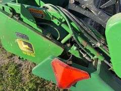 John Deere 925 Grain Head, Fits John Deere 9500 Combine, Fore/Aft Reel Cylinders, Has New Arm on Sickle Drive , Sickle Sections Good , Reel Has Composite Fingers, Stainless Pan, Poly Skids, Well Maintained Head, Header Cart IS NOT Included with Header.  See Lot #307A.