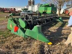 John Deere 925 Grain Head, Fits John Deere 9500 Combine, Fore/Aft Reel Cylinders, Has New Arm on Sickle Drive , Sickle Sections Good , Reel Has Composite Fingers, Stainless Pan, Poly Skids, Well Maintained Head, Header Cart IS NOT Included with Header.  See Lot #307A.