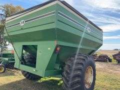 J & M 750 Grain Cart, 14” Discharge Auger, 1000 PTO, Rolling Tarp, No Scales, Tire Size 30.5L-32, Tires Hold Air