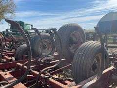 Kewanee Field Cultivator, 18’ Wide, Hydraulic Folding, Rolling Baskets in Back, Shovels Are Worn and Some Missing, 11L-15 SL Tires Fair Some Have Cracks, Hydraulic Lines Need Attention