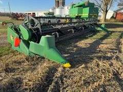 John Deere 925 Grain Head, Fits John Deere 9500 Combine, Fore/Aft Reel Cylinders, Has New Arm on Sickle Drive , Sickle Sections Good , Reel Has Composite Fingers, Stainless Pan, Poly Skids, Well Maintained Head, Header Cart IS NOT Included with Header.  See Lot #307A.