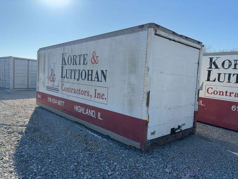 20’ Van Storage Box (used for Job-site Tool Storage) Dry Floor, Metal Roof Panels, Roll Up Door Has No Spring Or  Cables. Slight Cosmetic Damage To Exterior Walls.