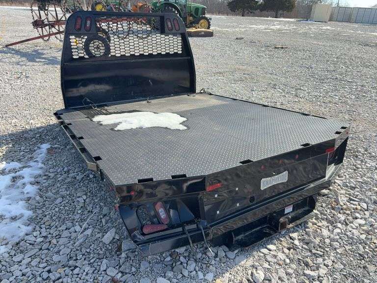 2020 Knapheide Flat Bed w/Linex Coating, Minor Damage Back Left Corner, 2 1/2” Reciever hitch, taillights, Stake Pockets, wiring harness for taillights, has a recessed 2 5/8 inch ball for a gooseneck trailers.