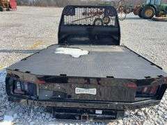 2020 Knapheide Flat Bed w/Linex Coating, Minor Damage Back Left Corner, 2 1/2” Reciever hitch, taillights, Stake Pockets, wiring harness for taillights, has a recessed 2 5/8 inch ball for a gooseneck trailers.