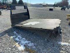 2020 Knapheide Flat Bed w/Linex Coating, Minor Damage Back Left Corner, 2 1/2” Reciever hitch, taillights, Stake Pockets, wiring harness for taillights, has a recessed 2 5/8 inch ball for a gooseneck trailers.