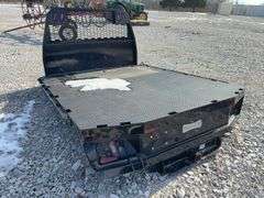 2020 Knapheide Flat Bed w/Linex Coating, Minor Damage Back Left Corner, 2 1/2” Reciever hitch, taillights, Stake Pockets, wiring harness for taillights, has a recessed 2 5/8 inch ball for a gooseneck trailers.