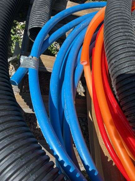 (3) 10’ Long 4” Sticks Of Drain Pipe 2-1/8” Thick and 1- Schedule 40, (2) Totes of Miscellaneous Joints and Elbows For 4” PVC Thin Wall and Schedule 40, Blue Red and Orange Pex Tubing, Partial Roll of 3” and 4” Drain Tile