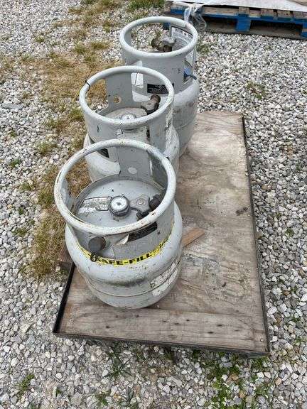 (3) 20lb Forklift Propane Tanks, All Tanks Have Gauges,One Tank Says 1/2 Full, Rolling Cart Included