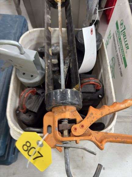 Bucket of caulk Guns, regular, quart and 2 part epoxy guns,