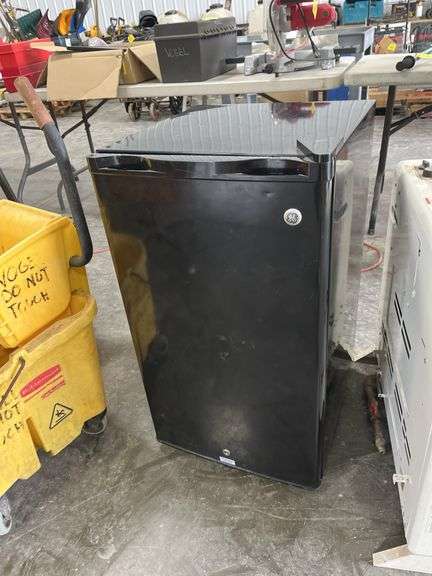 Dorm Size Refrigerator, Black in Color, Does Run, 31.5” Tall x 17.5” Wide x 19” Deep, Small Dents On Top