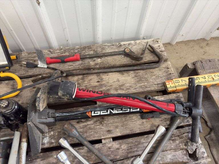 (2) Floor Jacks, 1 missing handle, (3) 4 way lug wrench standard and metric, (2) bicycle air pumps, (2) crow bars, (3) bottle jacks, flood light,
