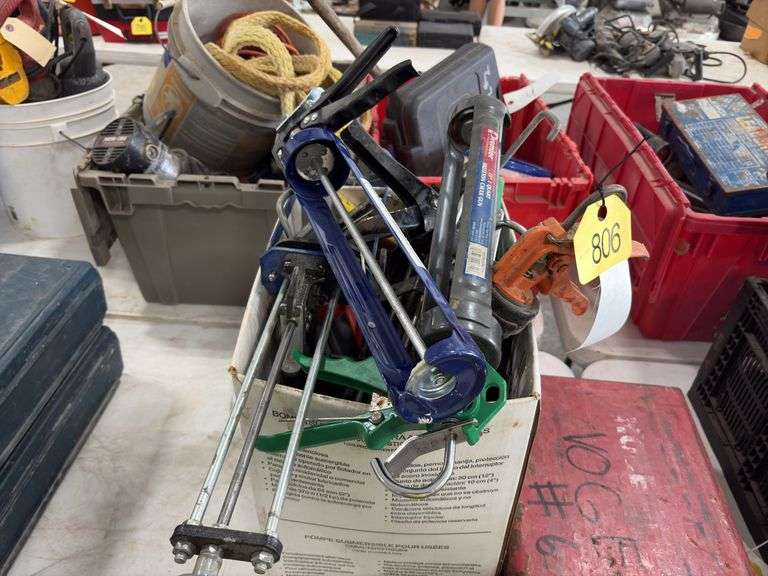 Bucket of Caulk Guns, quart, regular, and 2 part epoxy guns,