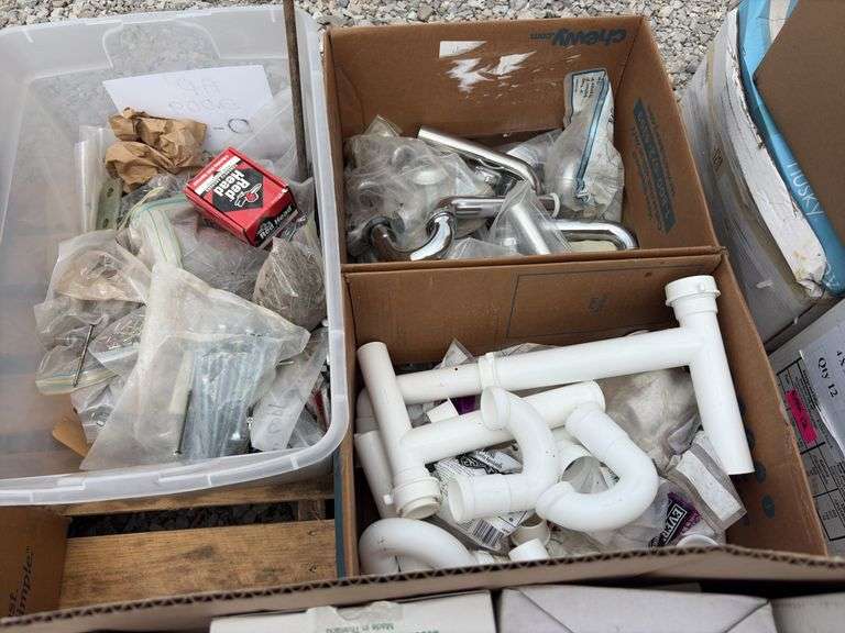 Box of 1 1/4” x 1 1/4” chrome p traps approx 40; (2) boxes of pvc and chrome p traps 1 1/4”dia, (2) totes of misc bolts and screws,