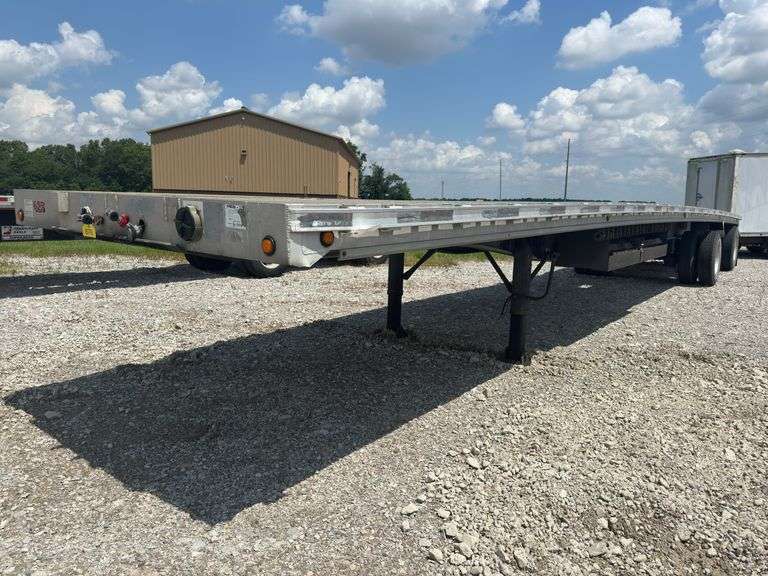 (TITLE) 2005 Ravens 48’ Aluminum Flat Semi Trailer, 22.5’S On Aluminum Outer Rims, 10’ Spread Axel, Aluminum Frame, Brakes In Good Shape (70%), Professional Weld Repair (Pictured), No Cracks On Frame, Air Ride Suspension, 102” Wide, Title In Hand,  5 th Wheel Pin Looks Good,Selling To Dissolve A Trucking Company Partnership.
