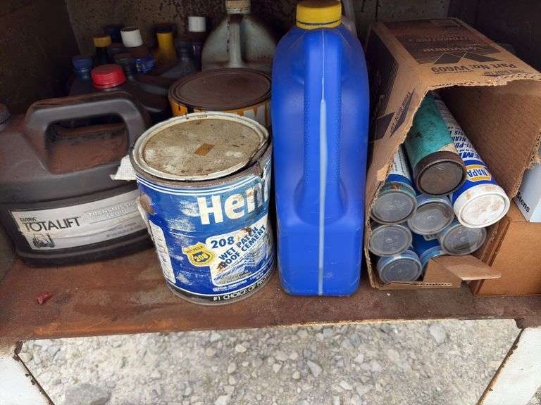 Metal Storage Cabinet 31” wide x 24” deep x 64” high, with 2 doors on cabinet, inside of cabinet has grease, transmission fluid, battery cleaner,  multi purpose lubricate, carburetor cleaner, house and siding cleaner, bag of rags, oil filters,