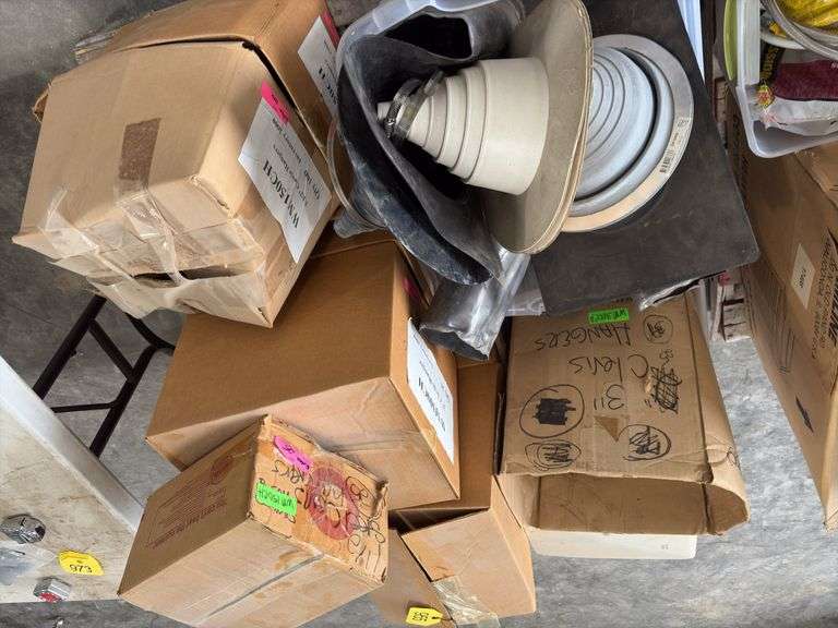 (4)Boxes of 3” Clevis Hangers approx 25 in a box, (2) Boxes of 1 1/2” Clevis Hangers approx 100 in a box, plastic tote of rubber witches hats pipe flashing for roof, plastic tote of a toilet tank,  slip joint connectors