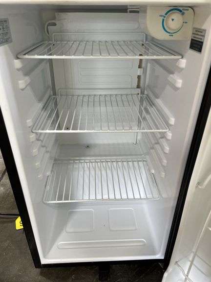 Dorm Size Refrigerator, Black in Color, Does Run, 31.5” Tall x 17.5” Wide x 19” Deep, Small Dents On Top