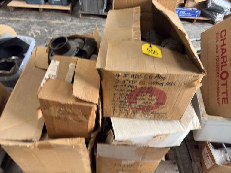 Pallet of various ABS Fittings, plastic tote of gas line, flexible stranded water supply line, Hilti Epoxy Caulk gun,