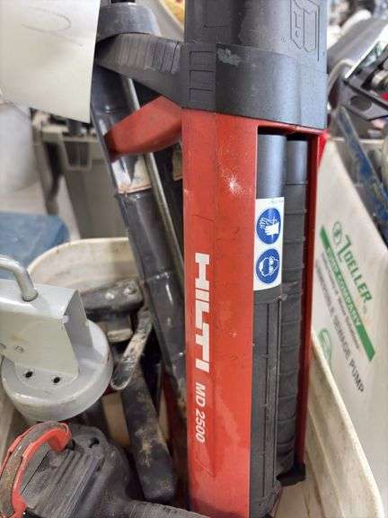 Bucket of caulk Guns, regular, quart and 2 part epoxy guns,