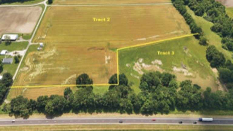 North of E 1625 Avenue/West of N 1125 Street including two older bins) 20.50 +/- Acres Tillable with wooded acres.  23.24 +/- Acres total, Rural Water Runs Along Frontage