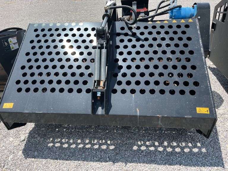 Unused AGT Skid Steer Landscape Rake,
6' wide,
Picks up material as small as 3/4",
Top cover opens hydraulically for ease of dumping,
Skid steer quick attach,
Standard flow hydraulics ,
Model # ECSSLR 72