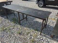 Workbench & work table, workbench measures 78” long x 25” wide x 36” high, Masonite top over 2x lumber, with some metal drawers, work table measures 8’ long X 30” wide X 31” high, Masonite top over 3/4” plywood, steel legs,