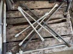 (2) Floor Jacks, 1 missing handle, (3) 4 way lug wrench standard and metric, (2) bicycle air pumps, (2) crow bars, (3) bottle jacks, flood light,