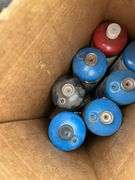 Pallet of First Aid Kits, Propane Cylinders, Boxes of Twine, Partial Roll of Small Rope, Box of Fire Extinguisher, Pump Up Sprayers, Galvanized Tum