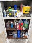 Metal Storage Cabinet 31” wide x 24” deep x 64” high, with 2 doors on cabinet, inside of cabinet has grease, transmission fluid, battery cleaner,  multi purpose lubricate, carburetor cleaner, house and siding cleaner, bag of rags, oil filters,