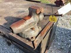 Workbench with 2 vises  size 4” & 3 1/2”, size of workbench is 73” long x 51” wide x 36” high, Masonite ove 2x lumber for workbench top, metal drawers front and back,
