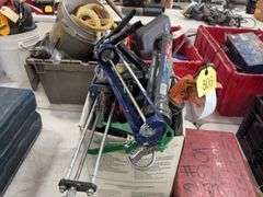 Bucket of Caulk Guns, quart, regular, and 2 part epoxy guns,