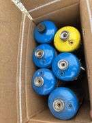 Pallet of First Aid Kits, Propane Cylinders, Boxes of Twine, Partial Roll of Small Rope, Box of Fire Extinguisher, Pump Up Sprayers, Galvanized Tum