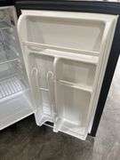 Dorm Size Refrigerator, Black in Color, Does Run, 31.5” Tall x 17.5” Wide x 19” Deep, Small Dents On Top