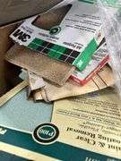 Several Bucket Stacker Organizers, Box of Sandpaper 9”x11” Sheets, Unused Paint Brushes, Drywall Tape, Used Paint Rollers, Rubber Mallet And More