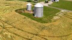 North of E 1625 Avenue/West of N 1125 Street including two older bins) 20.50 +/- Acres Tillable with wooded acres.  23.24 +/- Acres total, Rural Water Runs Along Frontage