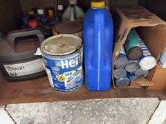 Metal Storage Cabinet 31” wide x 24” deep x 64” high, with 2 doors on cabinet, inside of cabinet has grease, transmission fluid, battery cleaner,  multi purpose lubricate, carburetor cleaner, house and siding cleaner, bag of rags, oil filters,