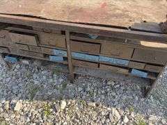 Workbench w/ (2) vises mounted to workbench, Vises are 3 1/2’’, Workbench size is 52” wide x 73” long x 36” high, Metal Frame w/ steel drawers with dividers in them, drawers on both sides of workbench bench, Masonite top over 2x lumber,