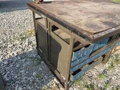 Workbench w/ (2) vises mounted to workbench, Vises are 3 1/2’’, Workbench size is 52” wide x 73” long x 36” high, Metal Frame w/ steel drawers with dividers in them, drawers on both sides of workbench bench, Masonite top over 2x lumber,